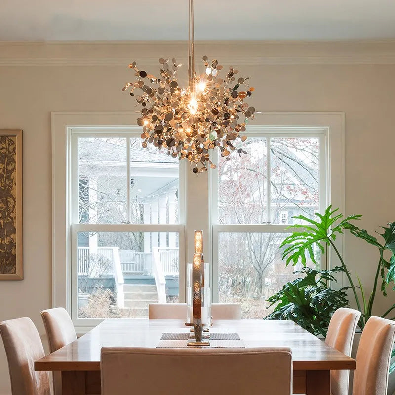 High-quality stainless steel Aurora chandelier with G9 light sources, available in Golden and Chrome finishes. Perfect for living rooms, dining rooms, bedrooms, villas, and lobbies, this versatile design blends luxury and functionality for a brilliant and inviting ambiance.