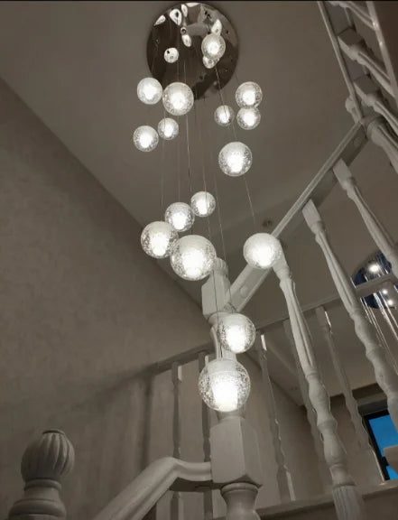 Polar Ball Stairs Chandelier with stainless steel frame and shimmering glass balls, showcasing modern design and icy elegance. Features energy-efficient LED G4 bulbs for bright, long-lasting illumination in contemporary interiors.