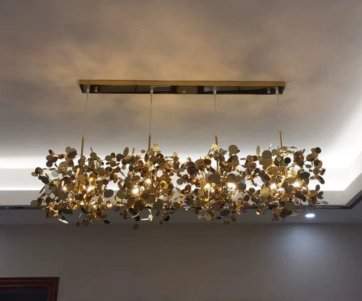 High-quality stainless steel Aurora chandelier with G9 light sources, available in Golden and Chrome finishes. Perfect for living rooms, dining rooms, bedrooms, villas, and lobbies, this versatile design blends luxury and functionality for a brilliant and inviting ambiance.